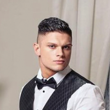 Handsome straight male companion in vest and bowtie